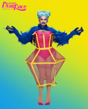 Halal Bae in a Canada's Drag Race promo photo wearing a blue feathered bolero and a hot pink, yellow-trimmed geometric fishnet dress.
